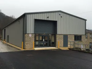 A High quality image of an Industrial Steel Framed Building designed, supplied and installed by Springfield Steel Buildings with insulated cladding and bespoke steel frame. SSB also provided the groundworks for the structure.